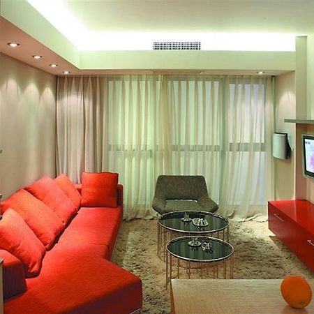 Seasons Park Apart Hotel Пекин Стая снимка